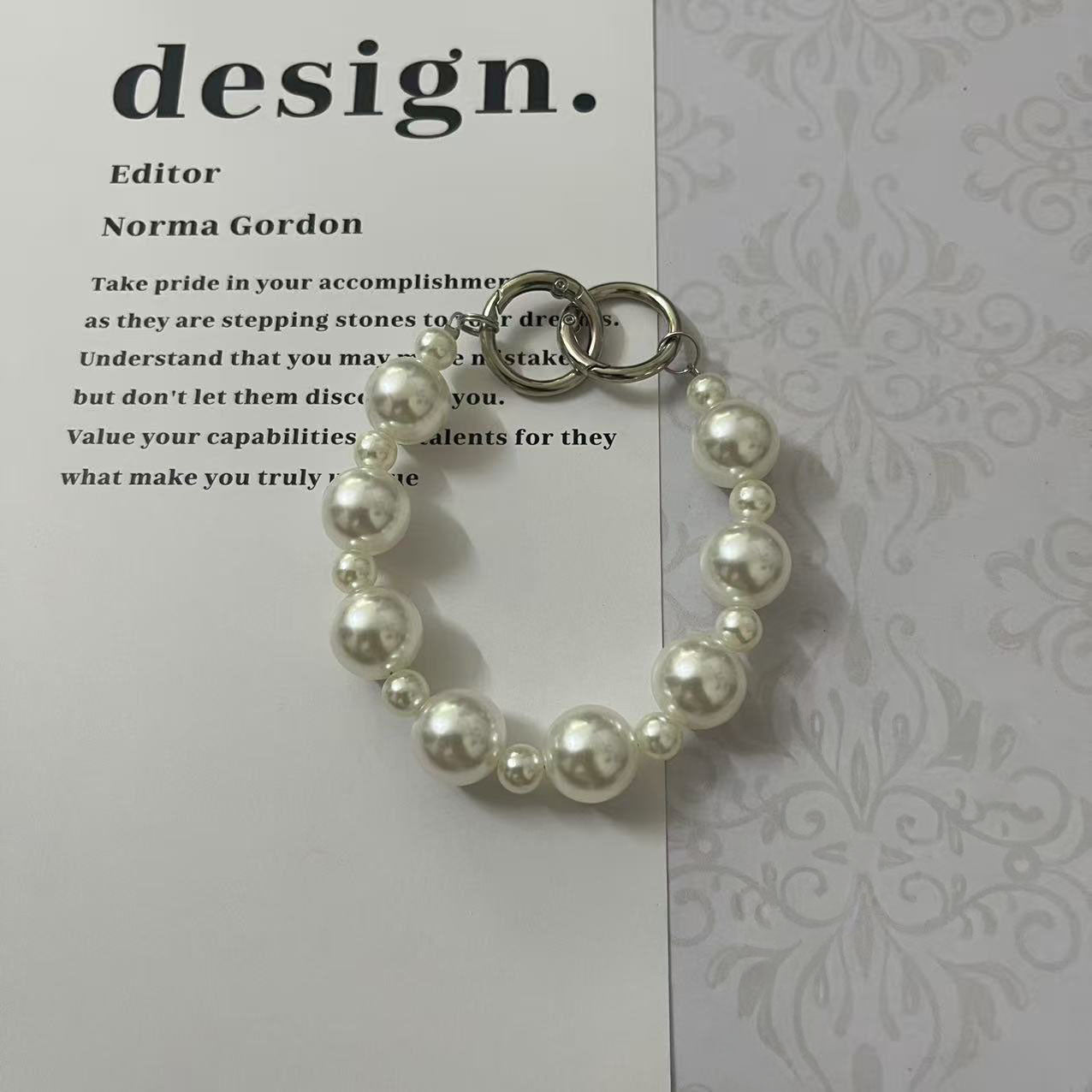 Classic Pearl Charm Strap – Elegant Glossy Beads for iPhone Case, Fashion Accessory | FAMAKA